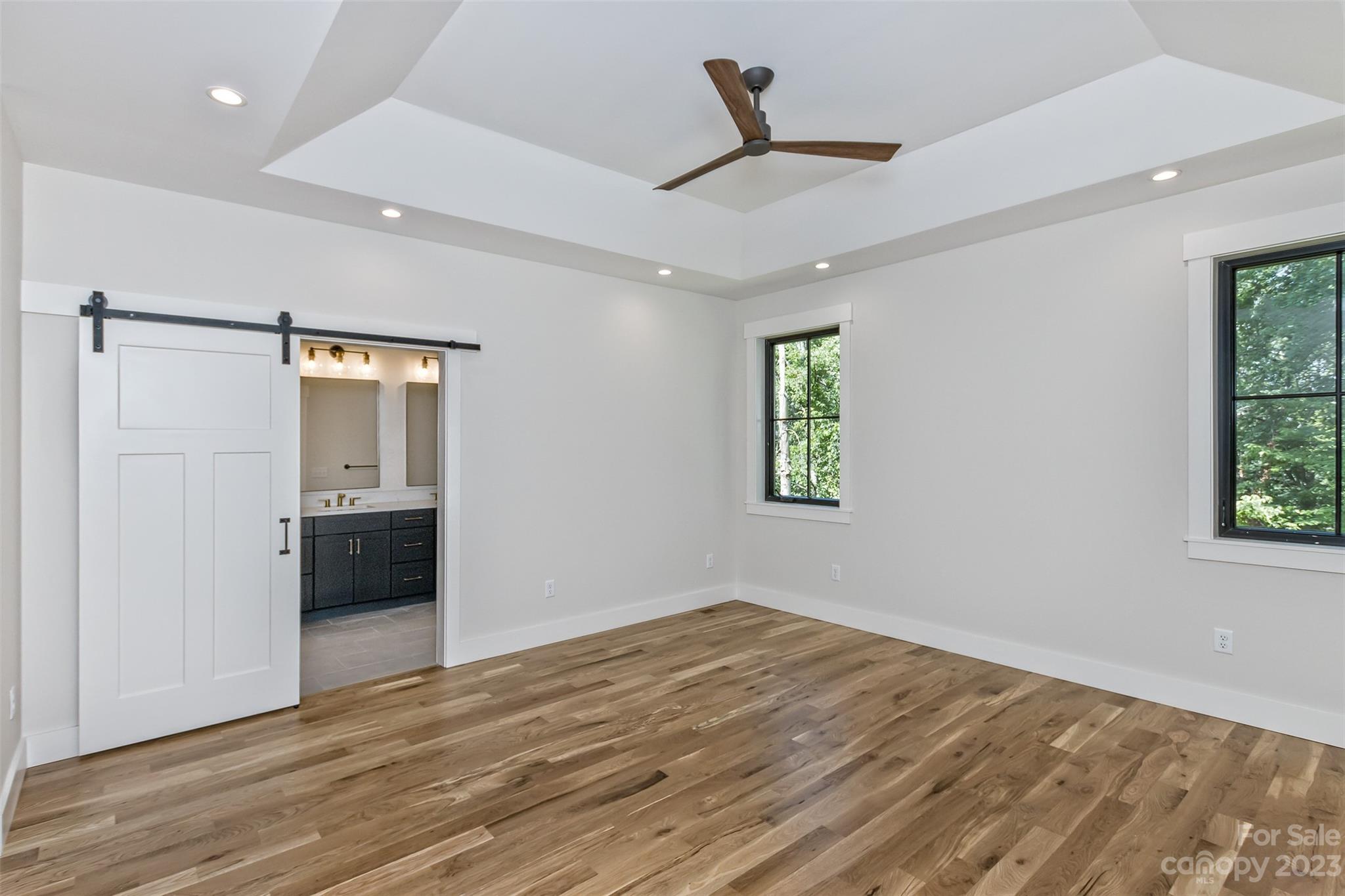 159 Gashes Creek Road Asheville, NC 28805 - Photo 25 of 48 a view of empty room with wooden floor and window