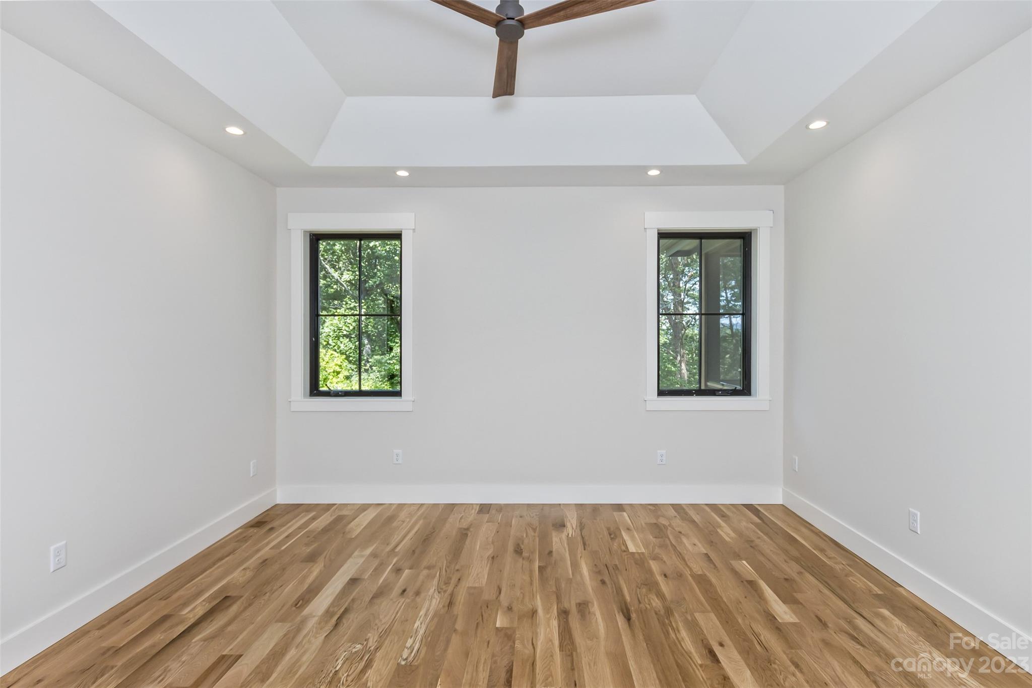 159 Gashes Creek Road Asheville, NC 28805 - Photo 26 of 48 an empty room with a window and wooden floor