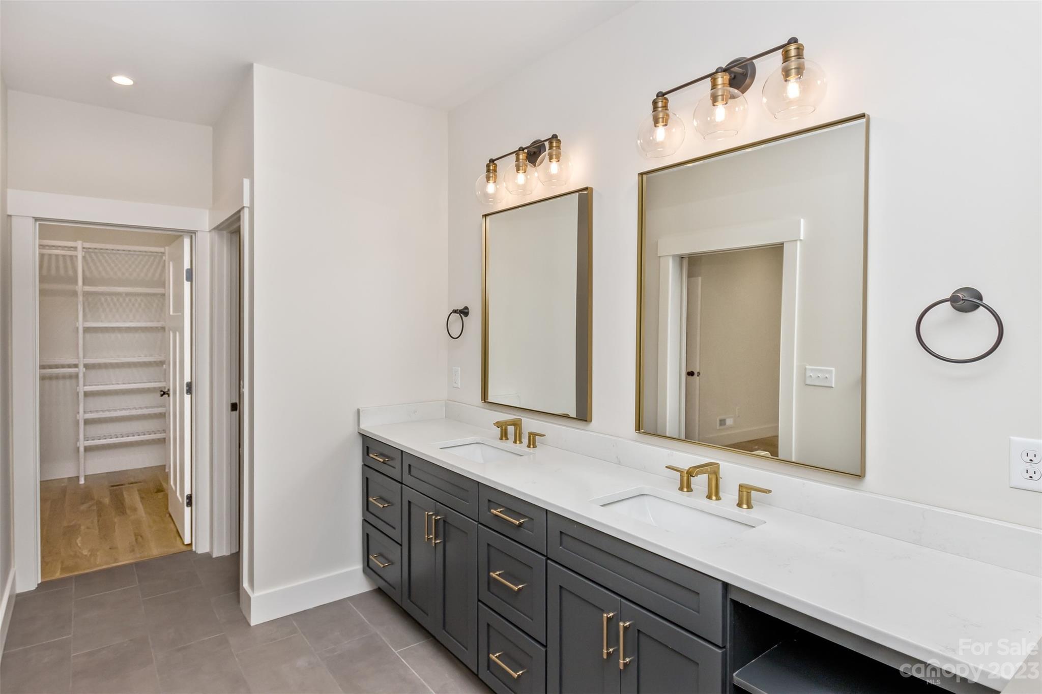 159 Gashes Creek Road Asheville, NC 28805 - Photo 30 of 48 a bathroom with a double vanity sink and a mirror