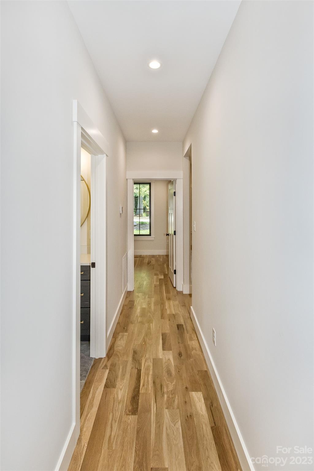 159 Gashes Creek Road Asheville, NC 28805 - Photo 32 of 48 a view of a hallway with wooden floor