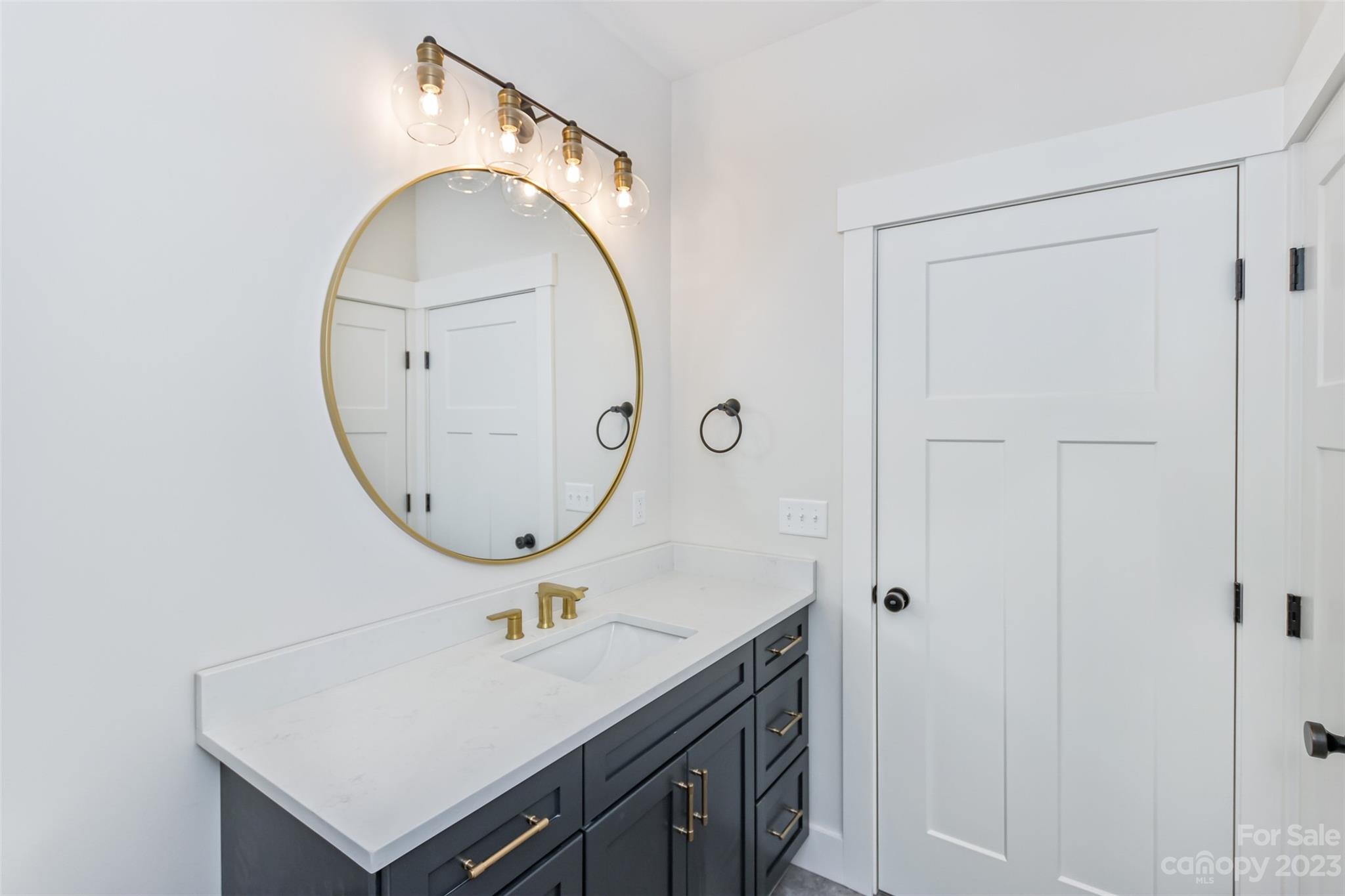 159 Gashes Creek Road Asheville, NC 28805 - Photo 37 of 48 a bathroom with a sink and a mirror
