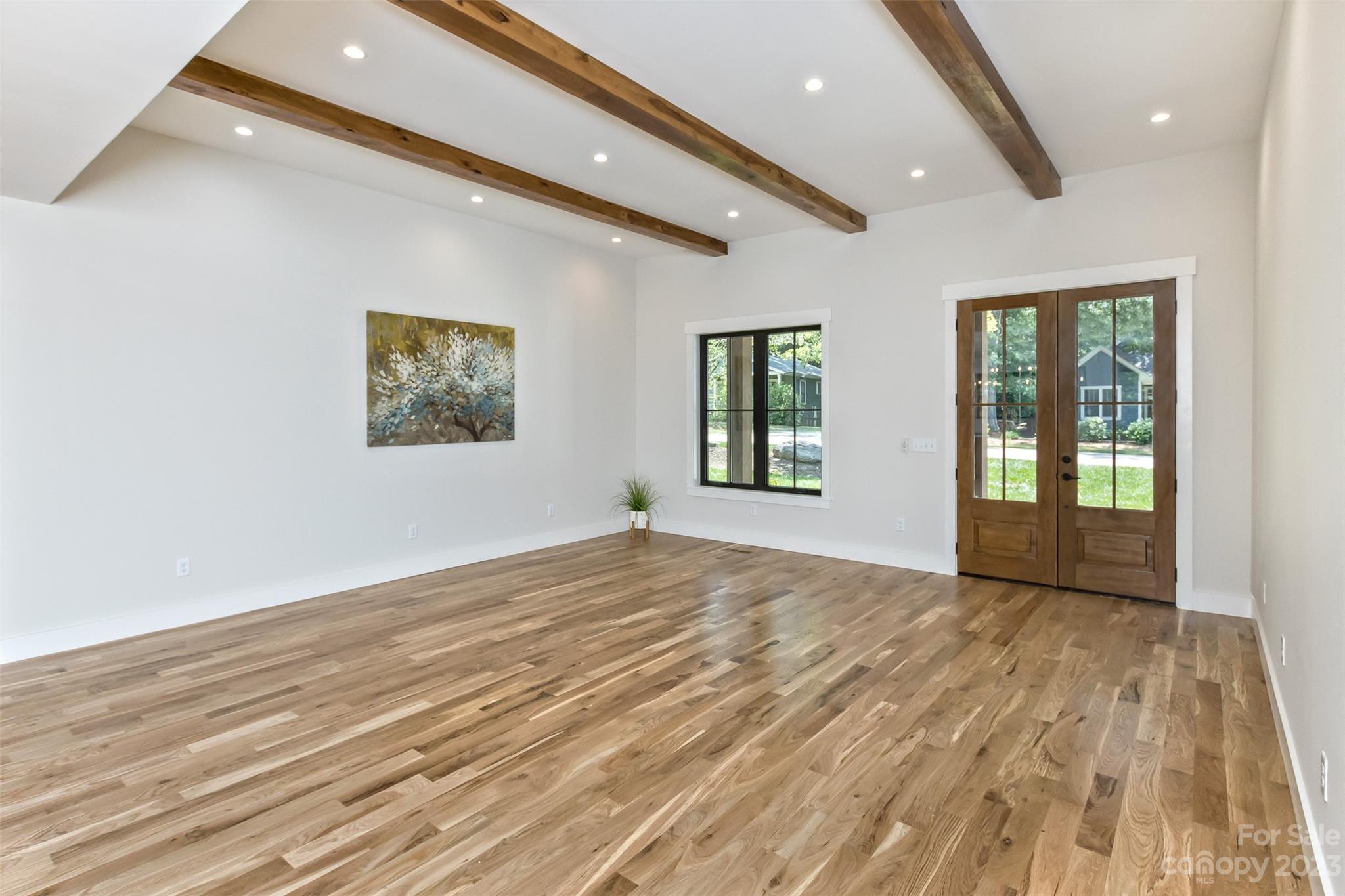 159 Gashes Creek Road Asheville, NC 28805 - Photo 7 of 48 a view of an empty room with wooden floor and a window