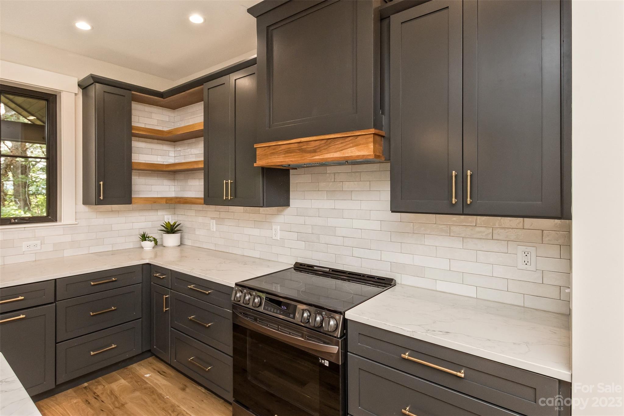 159 Gashes Creek Road Asheville, NC 28805 - Photo 10 of 48 a kitchen with a sink and cabinets