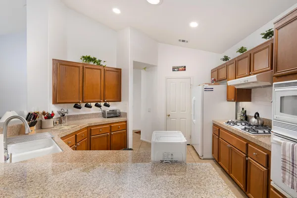 a spacious bathroom with a tub sink and mirror