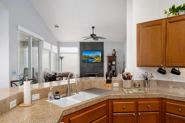 a kitchen with a sink and a refrigerator