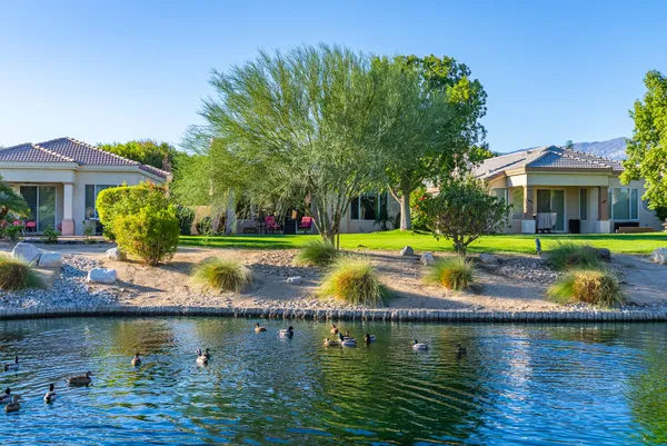 a view of house with swimming pool and outdoor space