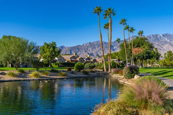 a view of a lake with a house in the background