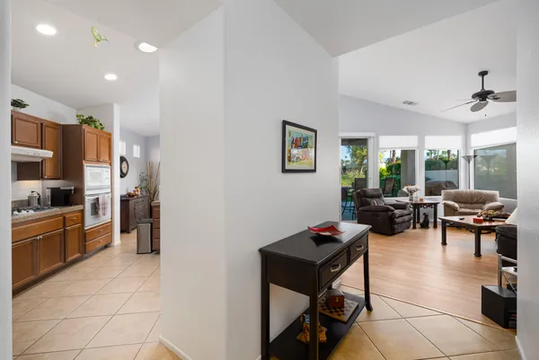 a living room with lots of furniture and painting on the wall