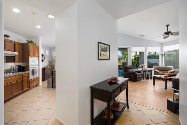 a living room with lots of furniture and painting on the wall