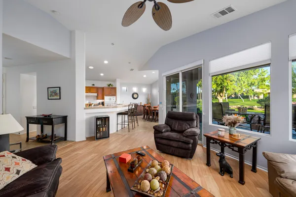 a living room with furniture fireplace and a table