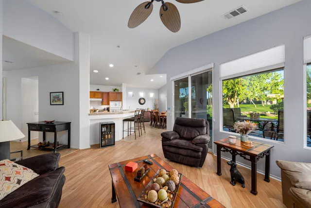 a living room with furniture fireplace and a table