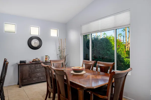 a view of a dining room with furniture window and outside view