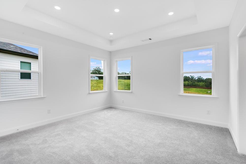 8810 Avonbrook Cl Ball Ground, GA 30107 - Photo 11 of 44 a view of an empty room with a window