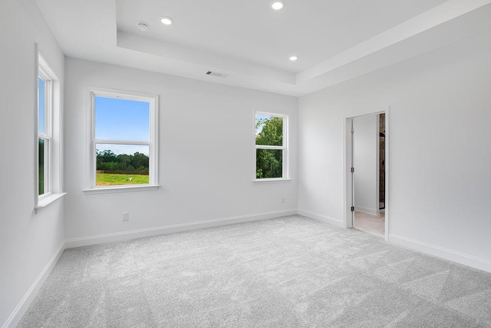 8810 Avonbrook Cl Ball Ground, GA 30107 - Photo 12 of 44 an empty room with windows