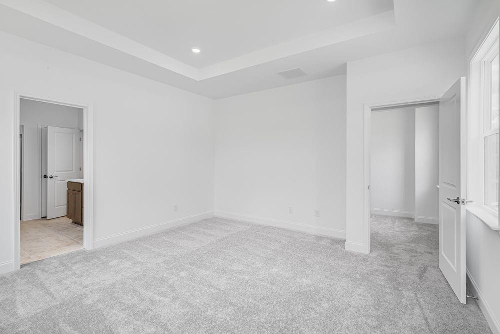8810 Avonbrook Cl Ball Ground, GA 30107 - Photo 13 of 44 an empty room with a bathroom