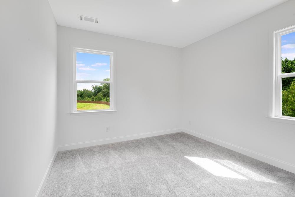 8810 Avonbrook Cl Ball Ground, GA 30107 - Photo 17 of 44 an empty room with a window