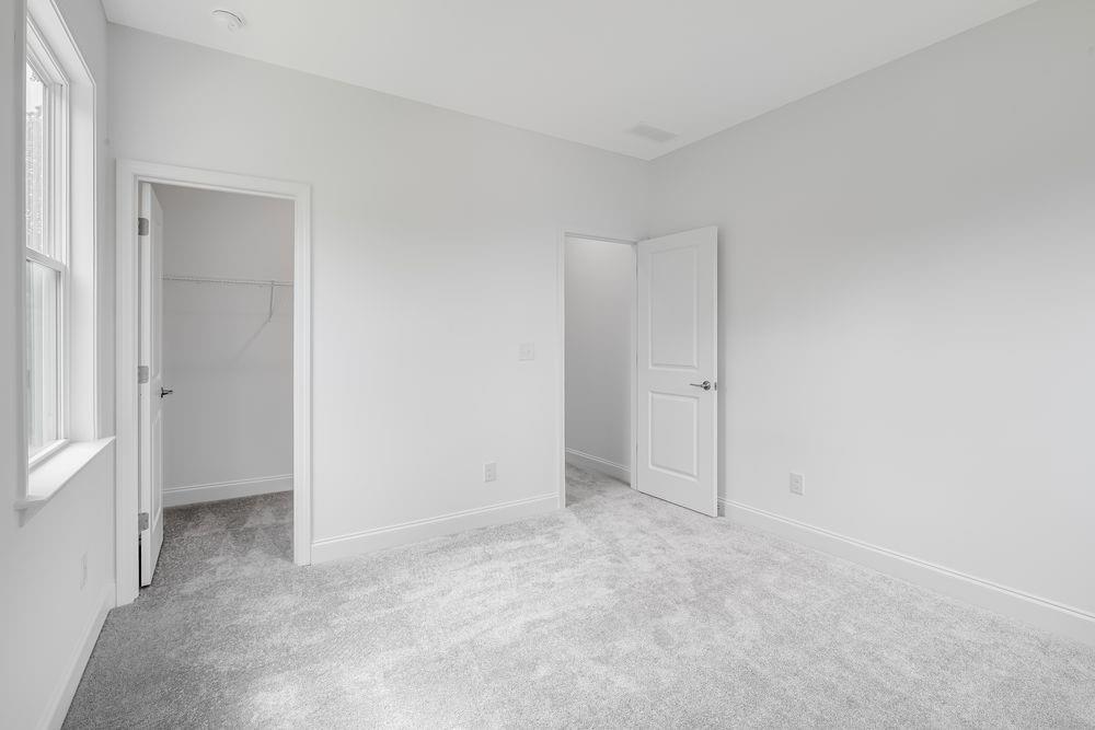 8810 Avonbrook Cl Ball Ground, GA 30107 - Photo 22 of 44 a view of an empty room