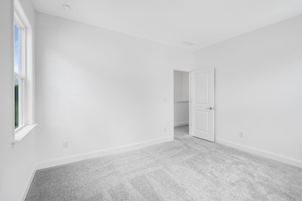 8810 Avonbrook Cl Ball Ground, GA 30107 - Photo 24 of 44 a view of an empty room and a window