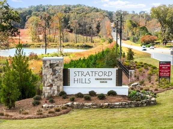 8810 Avonbrook Cl Ball Ground, GA 30107 - Photo 27 of 44 a view of a water with building in the background