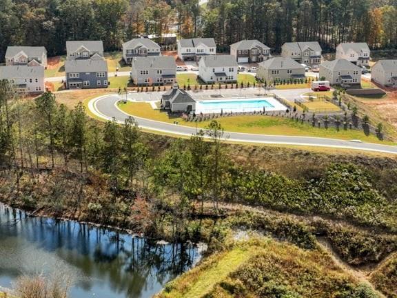 8810 Avonbrook Cl Ball Ground, GA 30107 - Photo 30 of 44 a view of a lake with houses