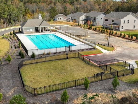8810 Avonbrook Cl Ball Ground, GA 30107 - Photo 33 of 44 an aerial view of a house with swimming pool and seating space