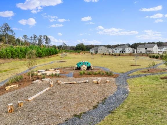 8810 Avonbrook Cl Ball Ground, GA 30107 - Photo 40 of 44 a view of a lake with beach