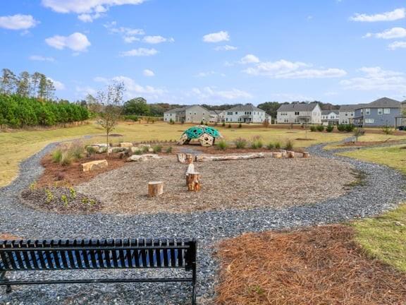 8810 Avonbrook Cl Ball Ground, GA 30107 - Photo 41 of 44 a view of a lake with houses in the back