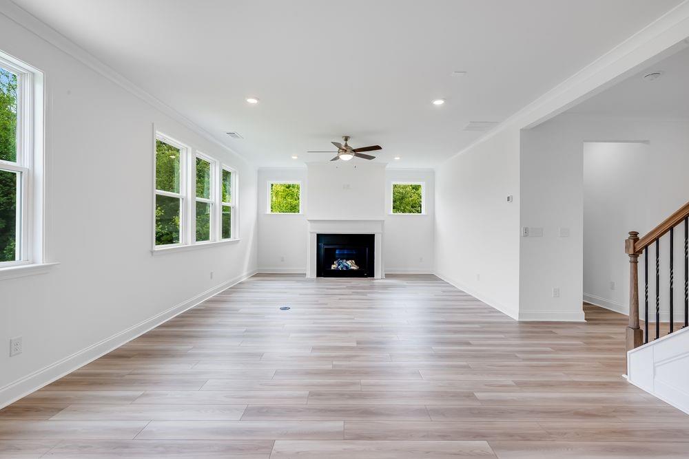8810 Avonbrook Cl Ball Ground, GA 30107 - Photo 9 of 44 a view of an empty room with a window and fireplace