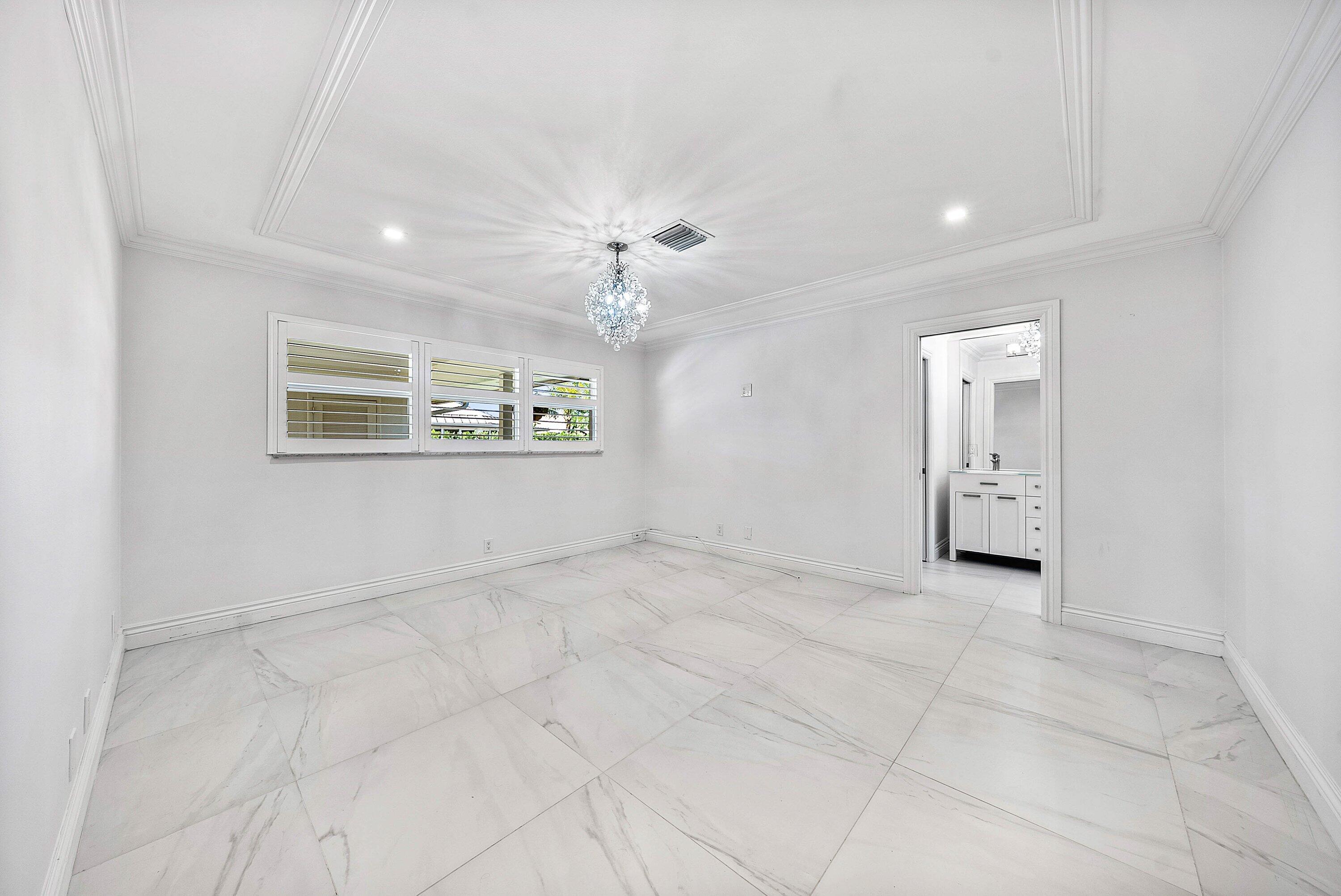 322 Cedar Key Circle Atlantis, FL 33462 - Photo 20 of 55 a view of an empty room with a window