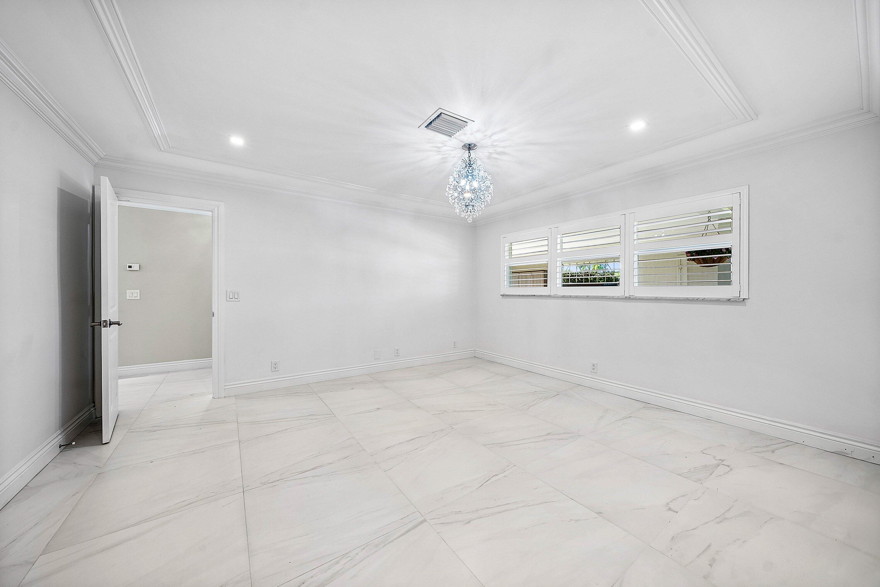 322 Cedar Key Circle Atlantis, FL 33462 - Photo 21 of 55 a view of an empty room with a window