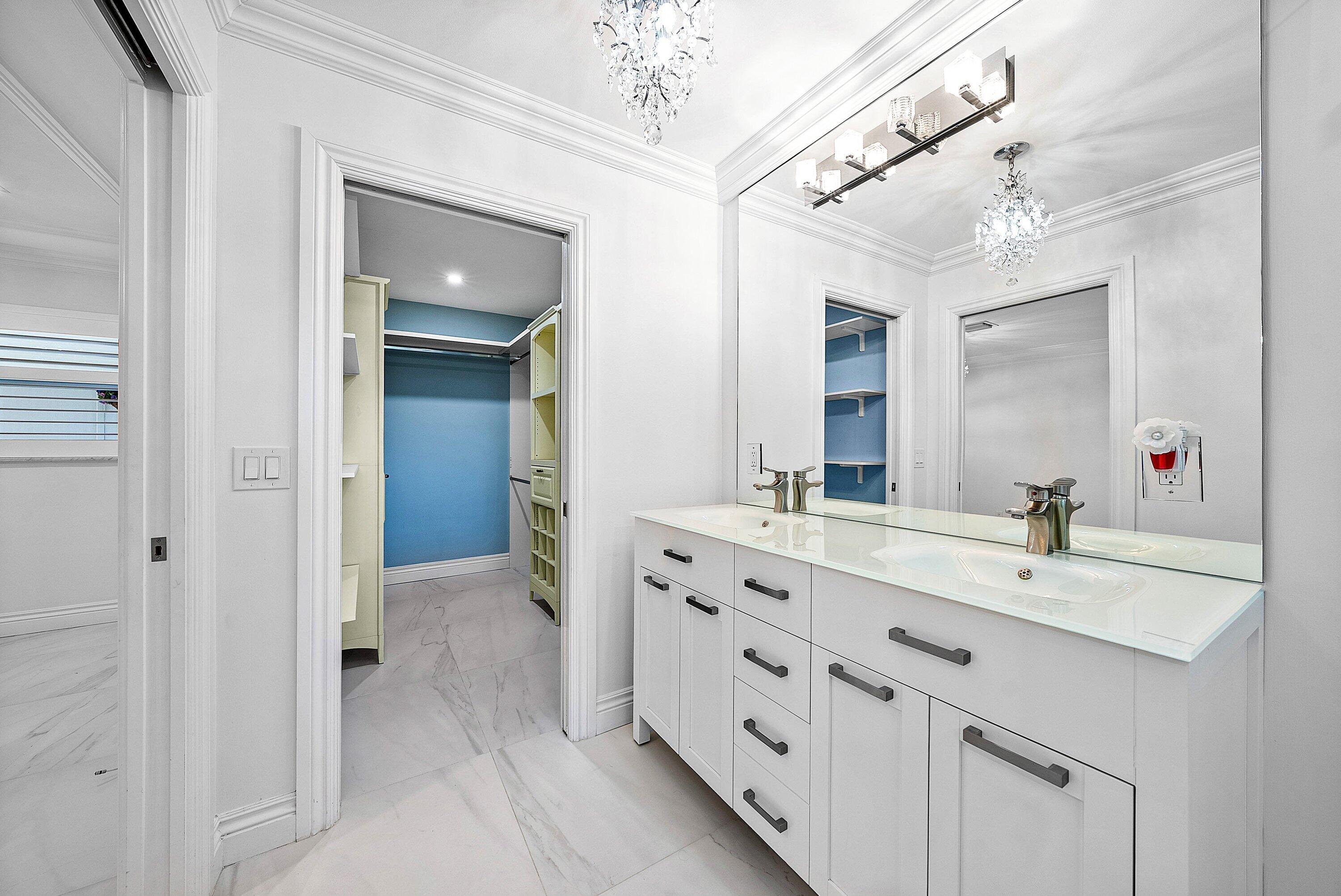 322 Cedar Key Circle Atlantis, FL 33462 - Photo 25 of 55 a spacious bathroom with a double vanity sink mirror and