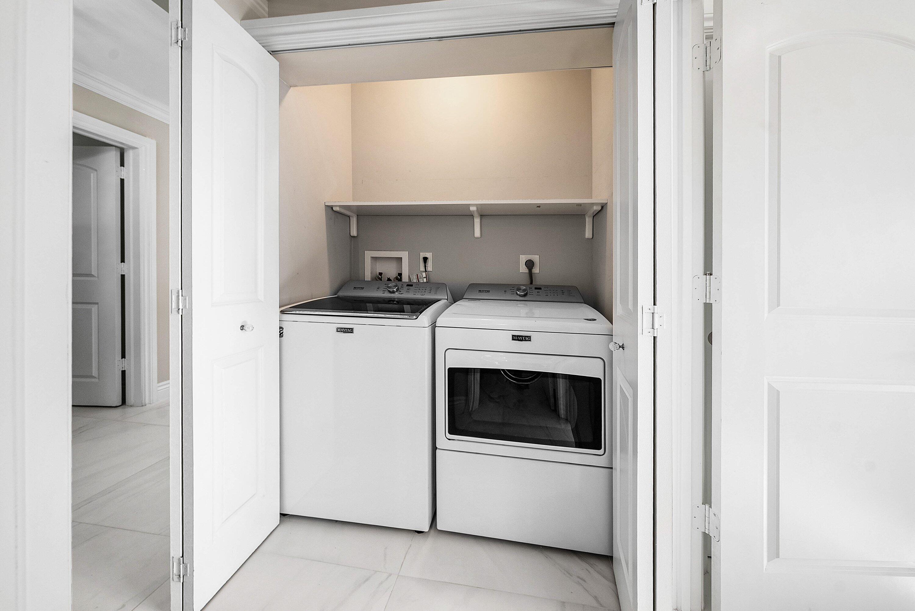 322 Cedar Key Circle Atlantis, FL 33462 - Photo 27 of 55 a kitchen with a stove and a white cabinet