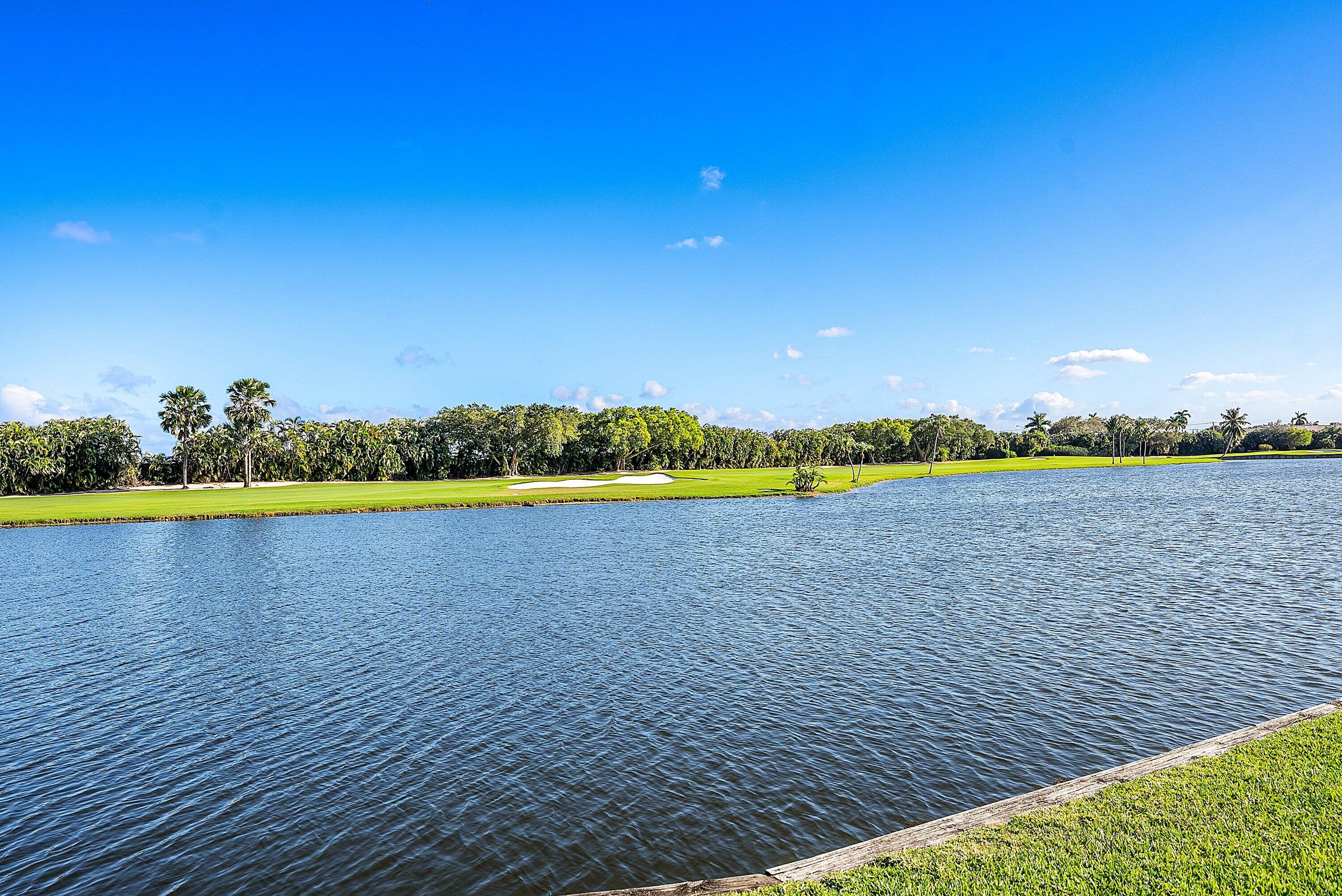322 Cedar Key Circle Atlantis, FL 33462 - Photo 37 of 55 a view of an ocean and beach