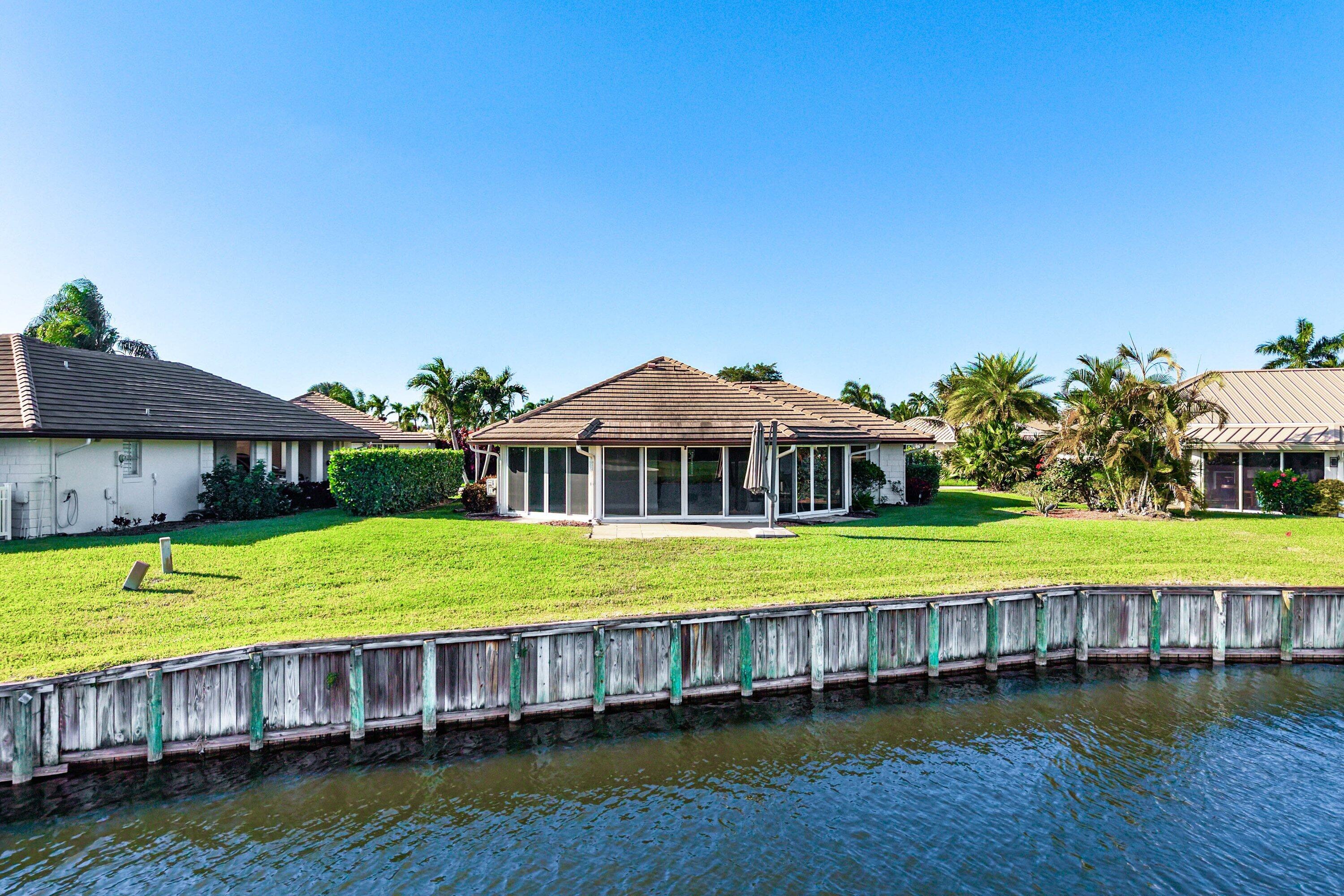 322 Cedar Key Circle Atlantis, FL 33462 - Photo 39 of 55 a view of a house with a yard balcony and sitting area