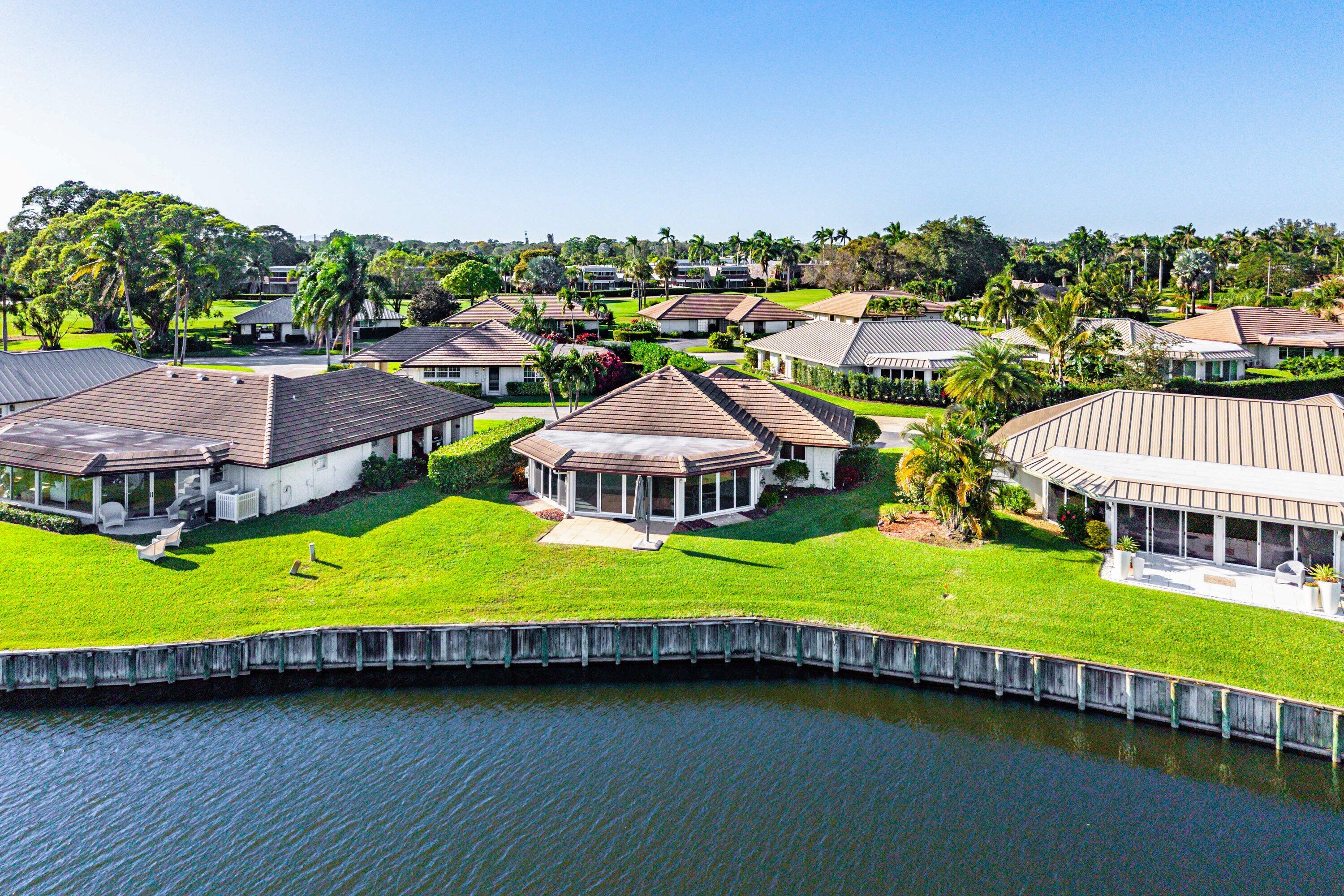322 Cedar Key Circle Atlantis, FL 33462 - Photo 40 of 55 an aerial view of a house with swimming pool garden and outdoor seating