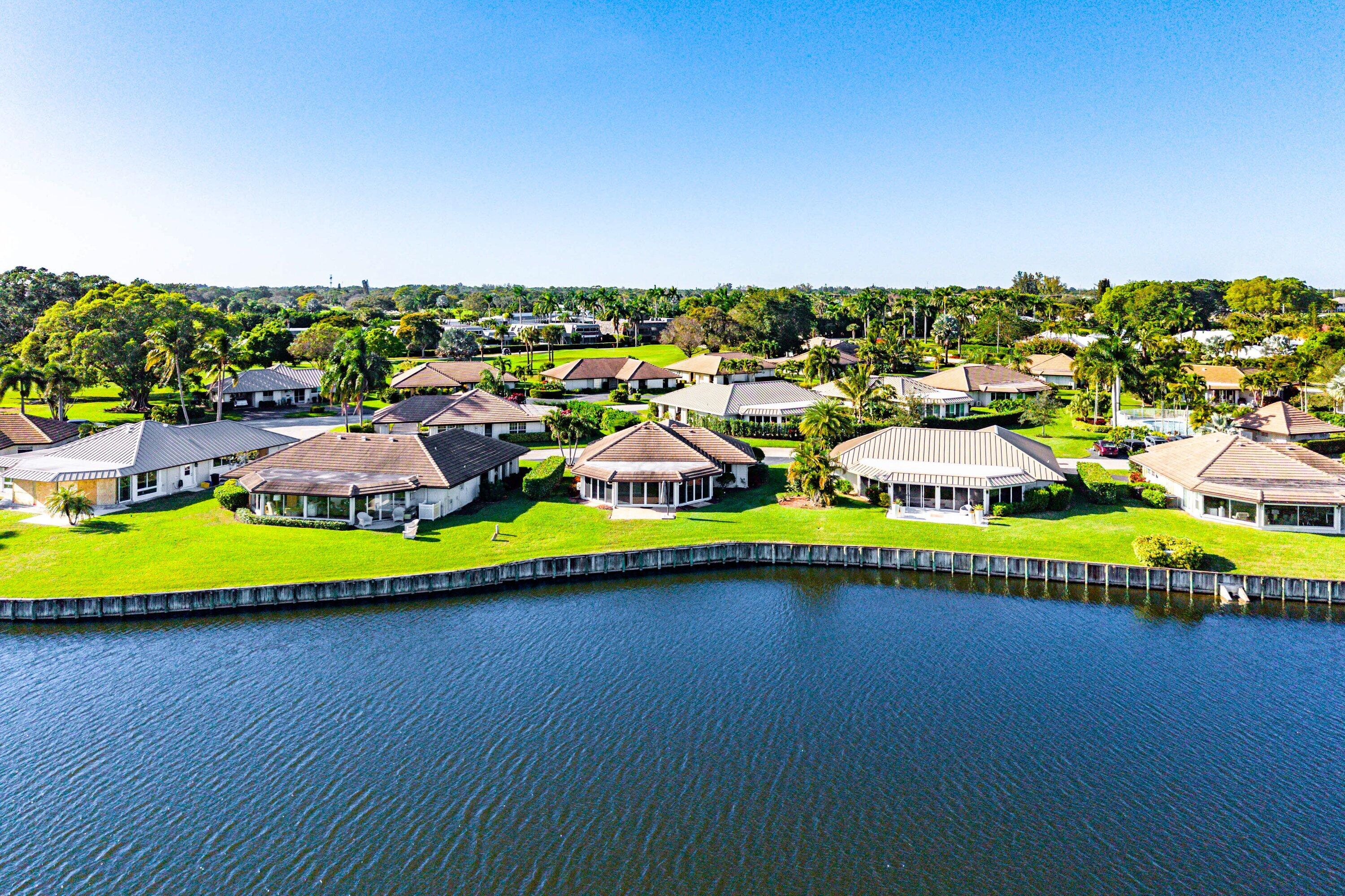 322 Cedar Key Circle Atlantis, FL 33462 - Photo 42 of 55 a view of swimming pool with outdoor seating and yard in back