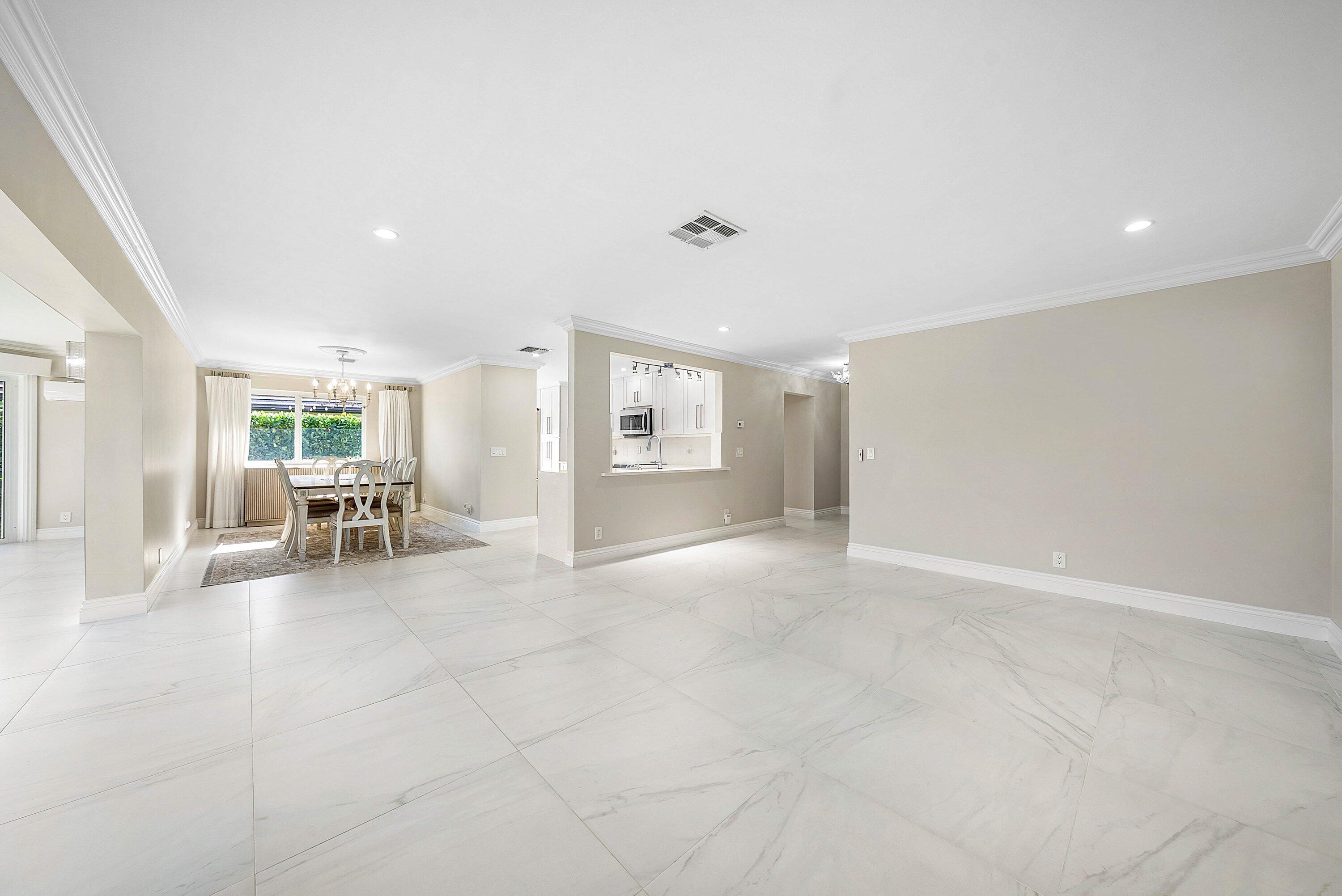 322 Cedar Key Circle Atlantis, FL 33462 - Photo 10 of 55 a view of a livingroom with furniture and lounge chair