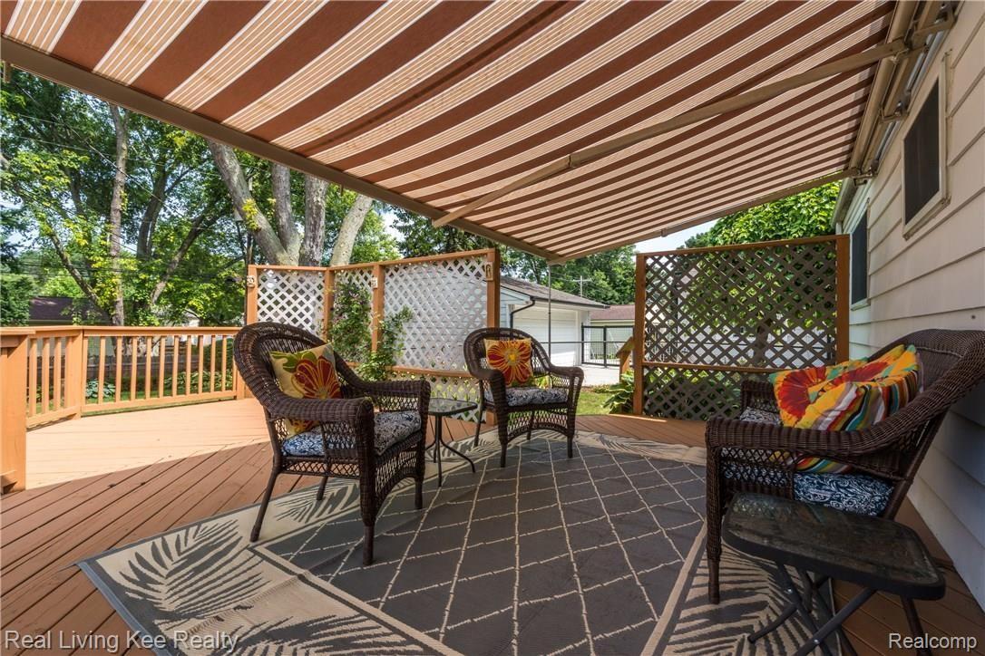 621 Rewold Drive Rochester, MI 48307 - Photo 3 of 34 Private deck with motorized awning to enjoy sun or shade.