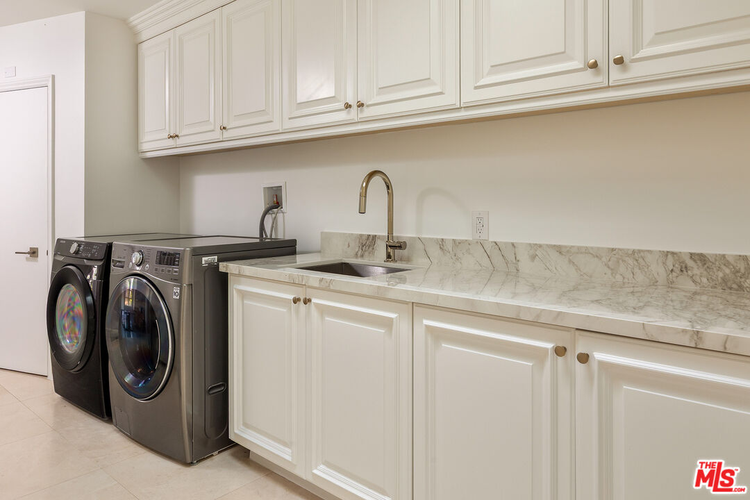 1630 Carla Ridge Beverly Hills, CA 90210 - Photo 14 of 22 a close view of a sink and washer in a kitchen