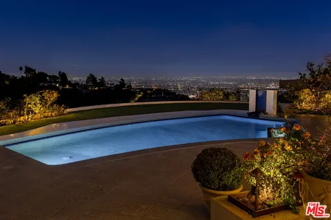 a view of a lake with a car park in front of it