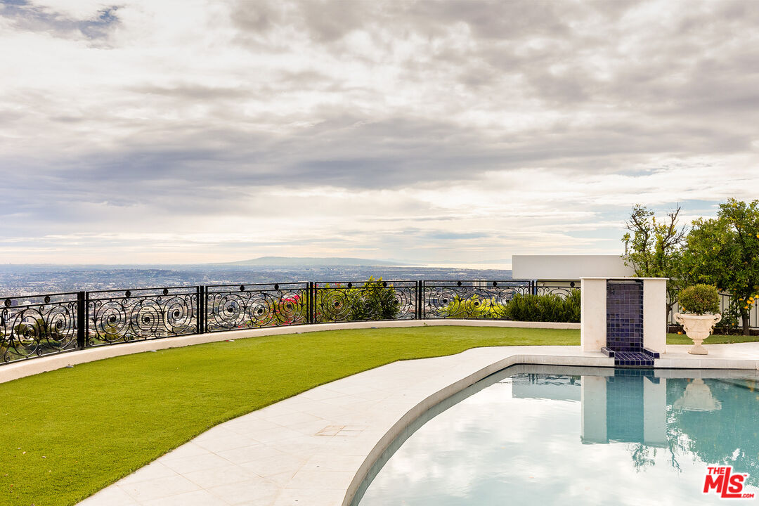 1630 Carla Ridge Beverly Hills, CA 90210 - Photo 2 of 22 a view of a lake with a city view