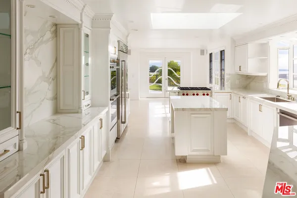 a bathroom with a sink a mirror and a bathtub