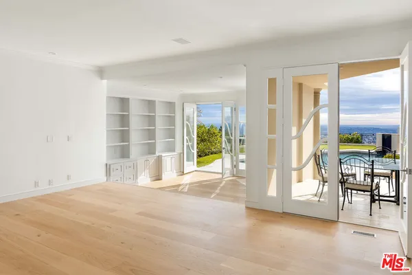 a view of an empty room and a window