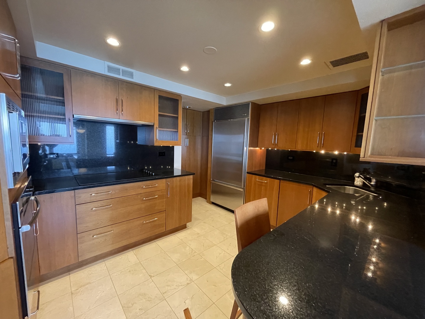 175 East Delaware Place, Unit 9007 Chicago, IL 60611 - Photo 14 of 29 a kitchen with stainless steel appliances a refrigerator and a stove top oven