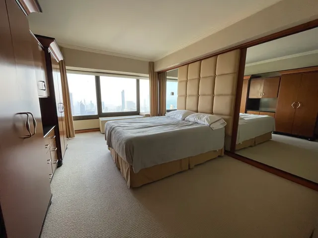 a bedroom with a bed and a closet