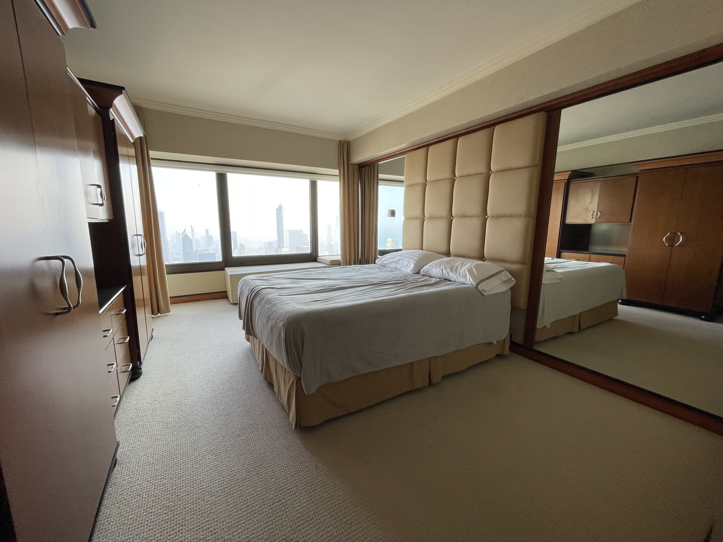 175 East Delaware Place, Unit 9007 Chicago, IL 60611 - Photo 18 of 29 a bedroom with a bed and large windows