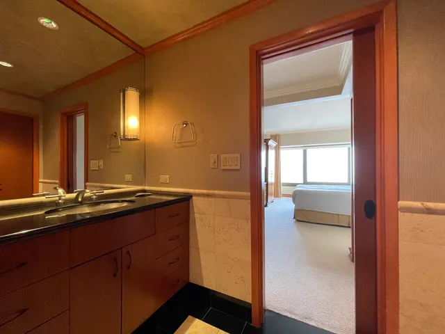 a bathroom with a glass shower door