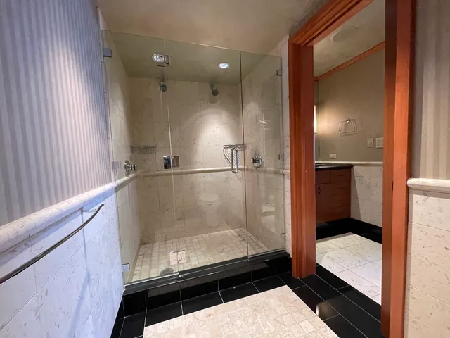 a bathroom with a toilet a sink and a shower