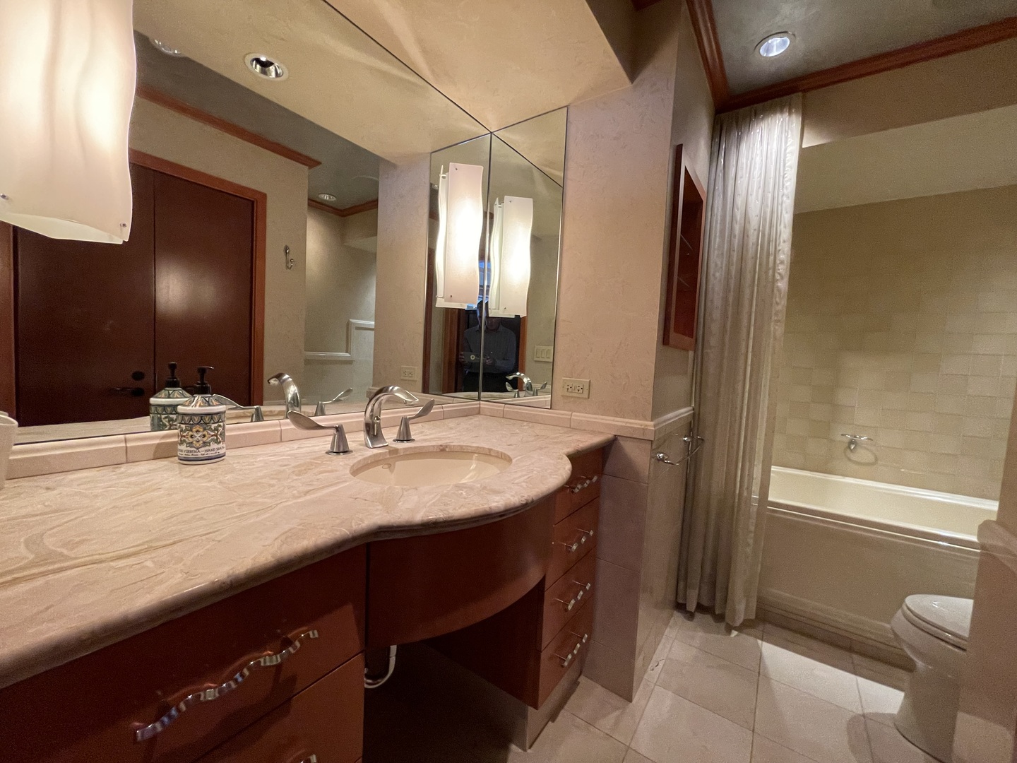175 East Delaware Place, Unit 9007 Chicago, IL 60611 - Photo 23 of 29 a bathroom with a granite countertop sink a mirror and a bathtub