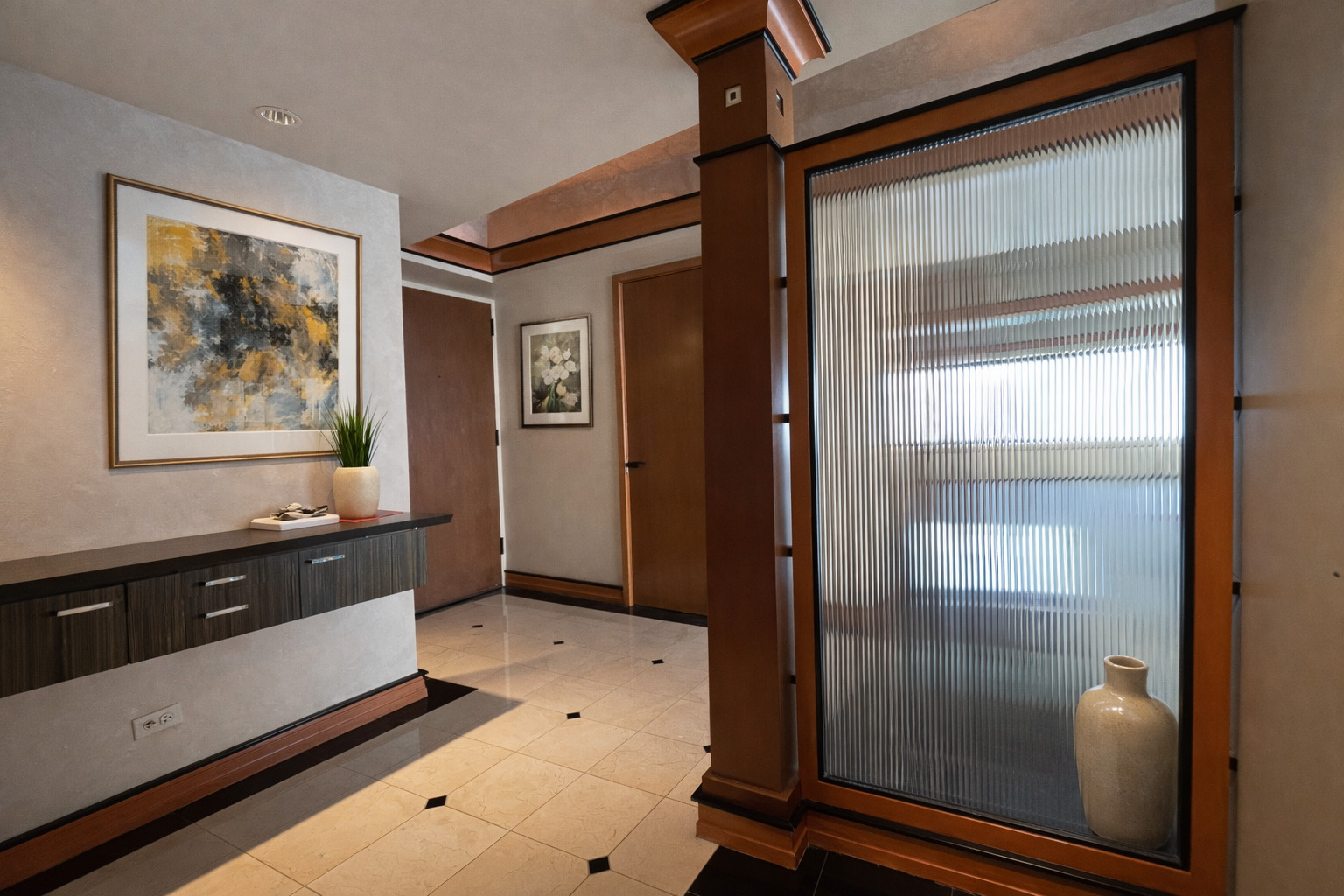 175 East Delaware Place, Unit 9007 Chicago, IL 60611 - Photo 5 of 27 a spacious bathroom with a glass door shower and a sink